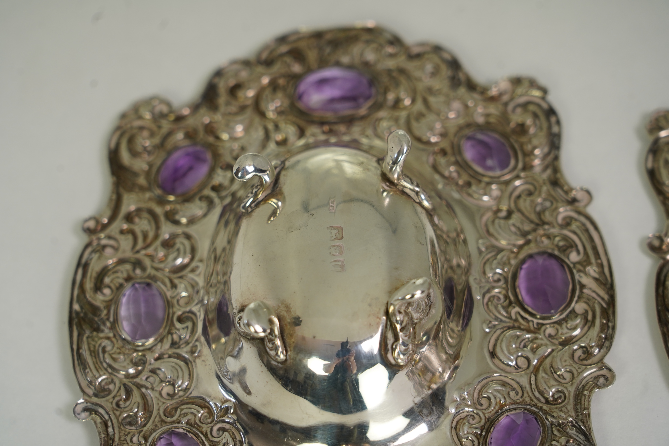 Two unusual late Victorian repousse silver dishes, by Daniel & John Welby, one border inset with eight oval cut amethysts, the other with eight oval cut citrines
